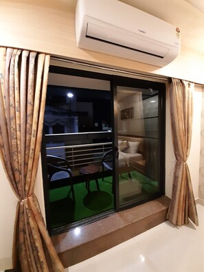 Deluxe Triple Room | Balcony view - Liza Regency (Chennai)