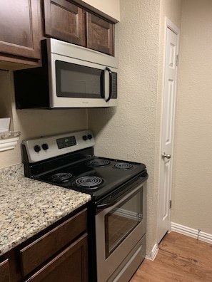 Microwave, dishwasher, cookware/dishes/utensils