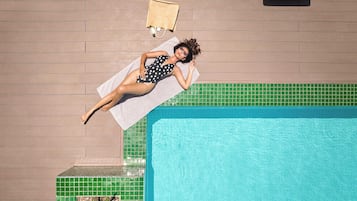 2 outdoor pools, open 6:00 AM to 10:00 PM, pool umbrellas, pool loungers