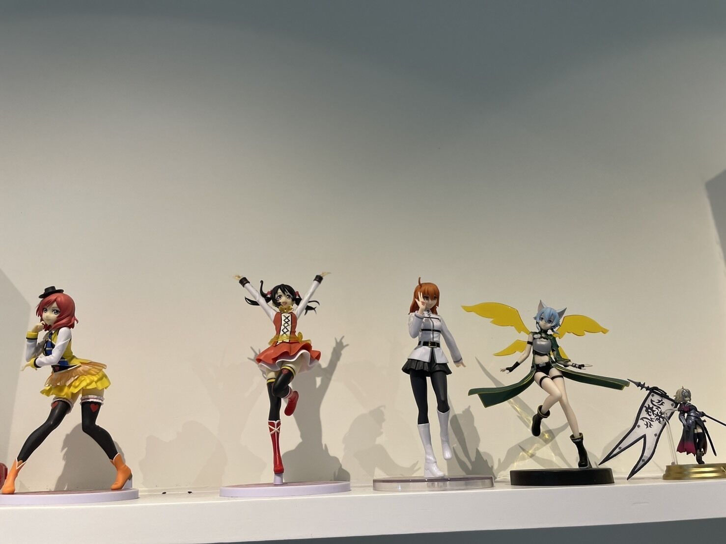 Four action figures on display.