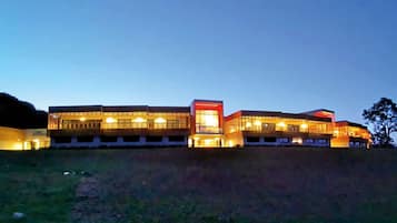 Stunning building with a modern architectural style, featuring large windows and a flat roof.