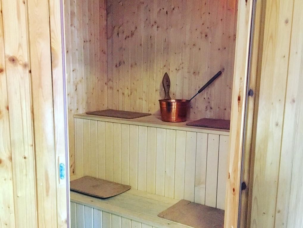 A sauna with wooden walls and benches.