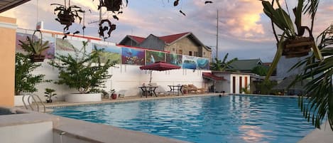 Outdoor pool, open 7:00 AM to 10:30 PM, sun loungers