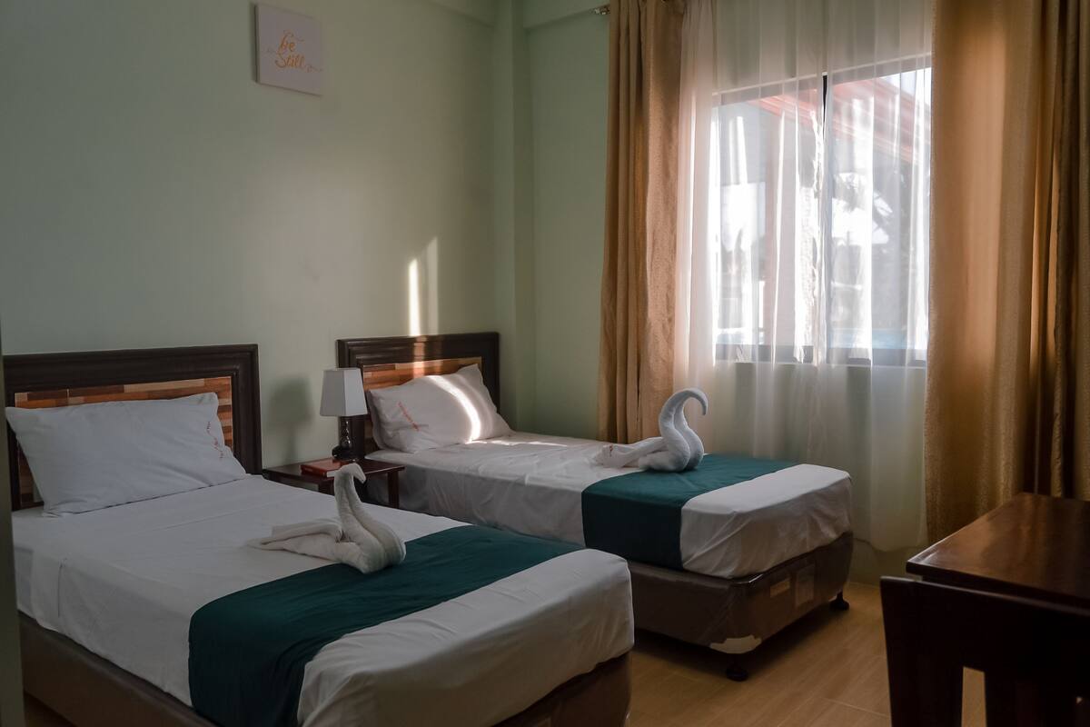 Deluxe Twin Room | Living room | Flat-screen TV