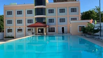 Outdoor pool, open 7:00 AM to 10:30 PM, pool loungers