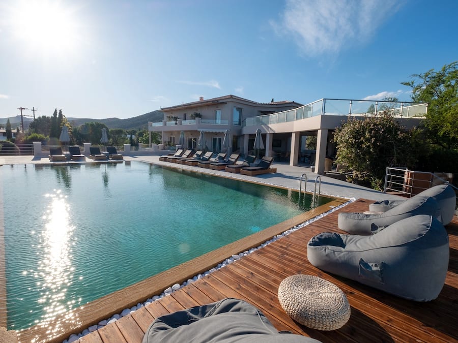 Seasonal outdoor pool, open 9:00 AM to 8:00 PM, pool umbrellas