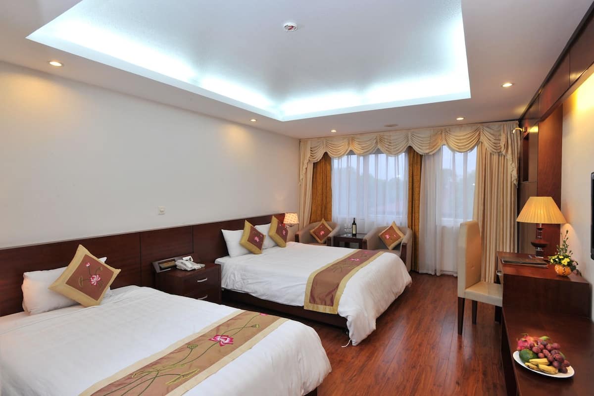 Habitación estándar, varias camas | Área de sala de estar