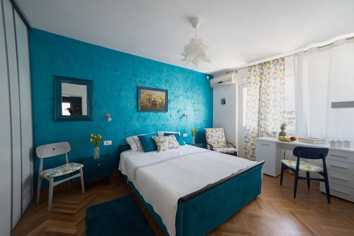 Premium bedding, memory-foam beds, desk, laptop workspace