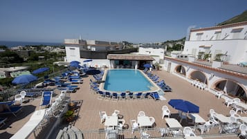 2 indoor pools, outdoor pool, open 7:00 AM to 7:30 PM, pool umbrellas
