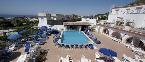2 indoor pools, outdoor pool, open 7:00 AM to 7:30 PM, pool umbrellas