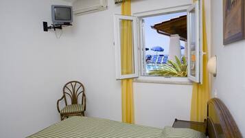 Economy Quadruple Room | In-room safe, desk, bed sheets