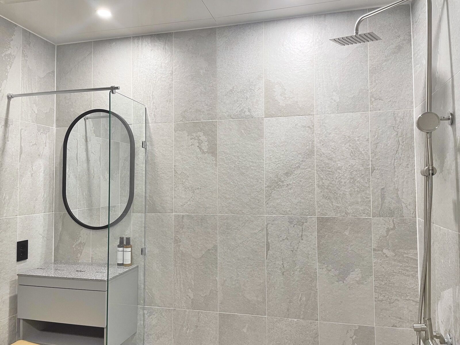 shower, bathrobes, slippers, towels