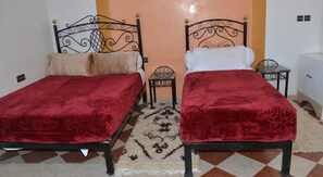 Triple Room, Multiple Beds, Private Bathroom | Desk, blackout curtains, free WiFi, bed sheets