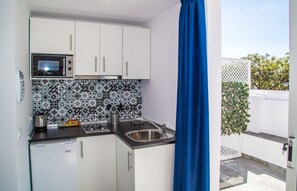 Suite Grand, 2 llits de matrimoni | Cuina bàsica privada | Microones, cafetera i tetera i bullidora elèctrica