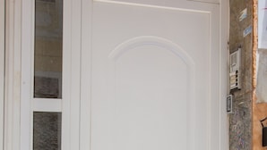 A white door with a handle and a small window above it. - Raise Rooms in Center of Athens (Athens)