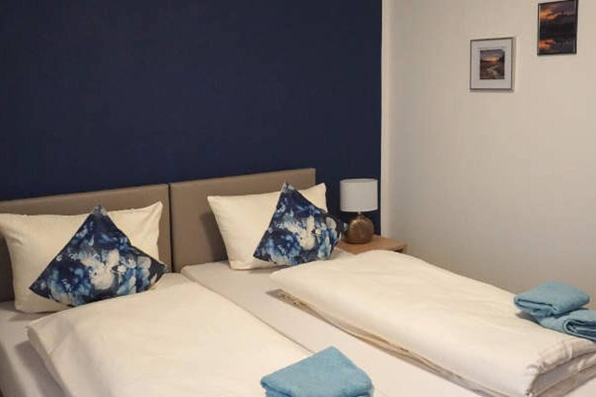 Hypo-allergenic bedding, desk, laptop workspace, blackout curtains