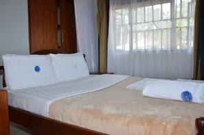 In-room safe, desk, laptop workspace, bed sheets