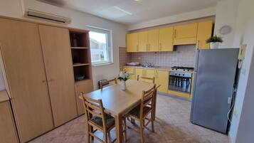 Apartment, Sea View | Private kitchen | Fridge, oven, stovetop, dishwasher