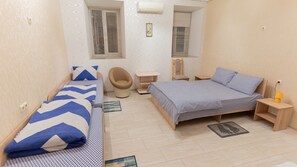 Family Room, Courtyard View | Soundproofing, iron/ironing board, free WiFi, bed sheets
