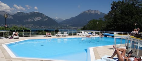 Seasonal outdoor pool, pool umbrellas, pool loungers