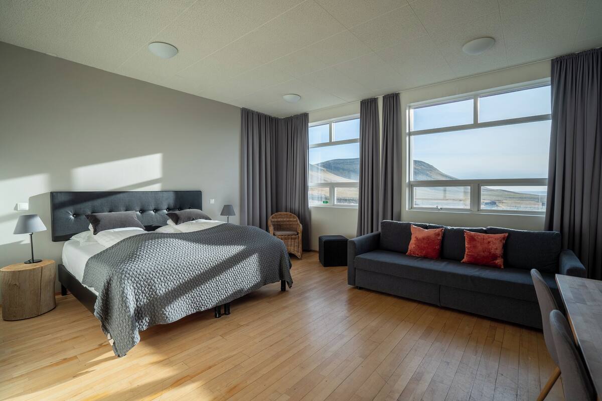 superior double room, 1 king bed with sofa bed, private bathroom, ocean view | 1 bedroom, individually furnished, desk, laptop workspace