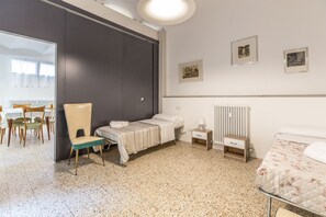 Desk, travel cot, bed sheets