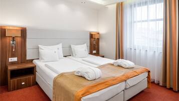 Kamar Double atau Twin Comfort | 1 kamar tidur, minibar, brankas, dan tirai kedap cahaya
