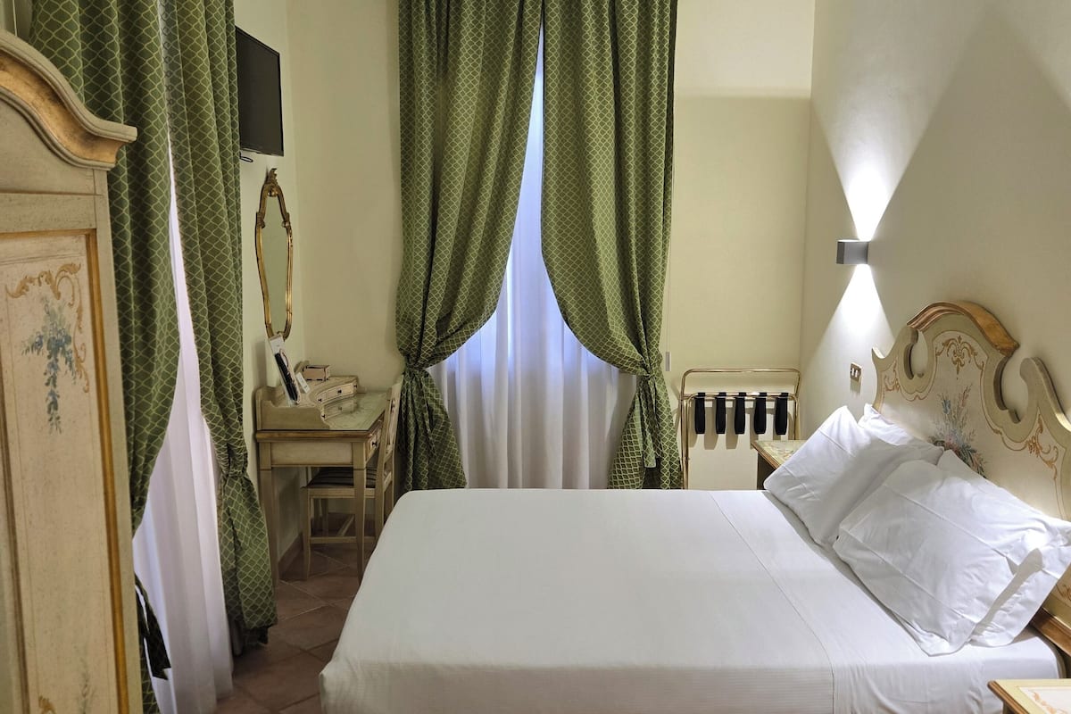 Standard Double Room | Living area | Flat-screen TV