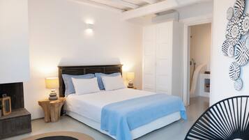 Suite senior, vista al mar | Ropa de cama de alta calidad y minibar