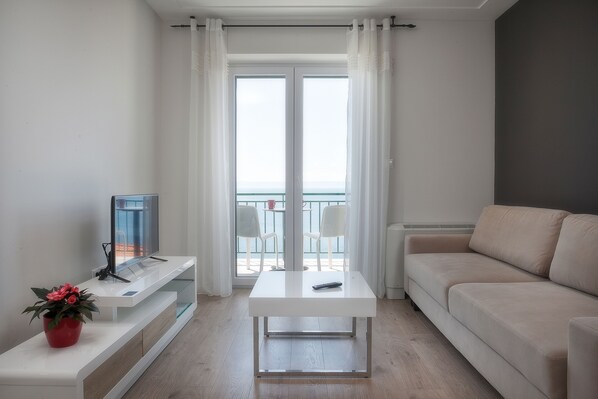 Apartment, 1 Bedroom, Sea View | Living room | Flat-screen TV - Apartment Juric (Brela)