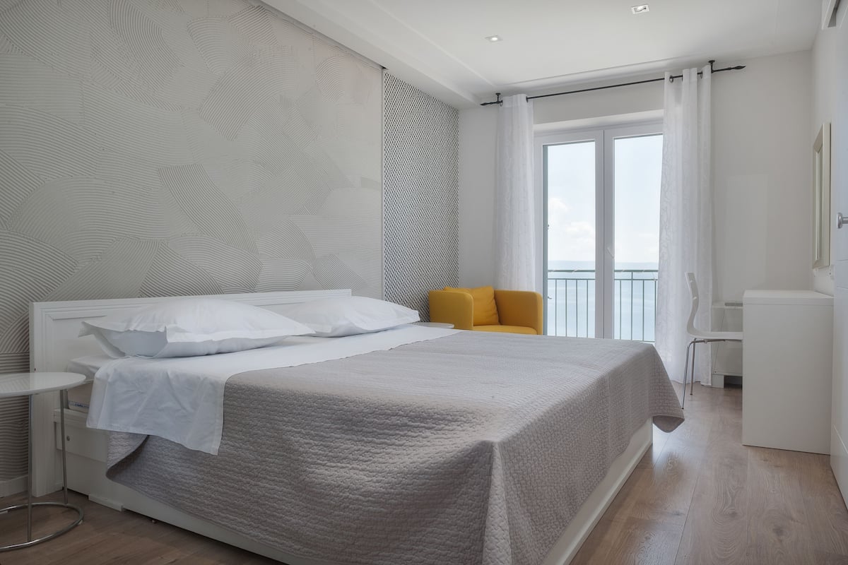 Apartment, 1 Bedroom, Sea View | Iron/ironing board, WiFi (free), bed sheets