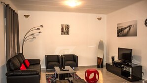 Apartment, 1 Bedroom | Living room - Sci Yassmani (Port Gentil)
