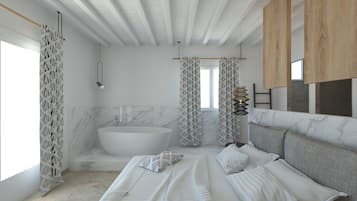 Suite Junior, baignoire, vue mer | Coffres-forts dans les chambres, décoration personnalisée