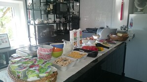 A buffet setup with various food items and beverages. - Rural tourism homestead JOLE (Rumšiškes)