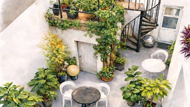 An outdoor patio with a round table and two chairs, surrounded by potted plants and a spiral staircase. - Chambres d'Hotes O Anges (Arles)