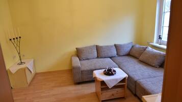 Apartment, 3 Bedrooms | Living area | Flat-screen TV