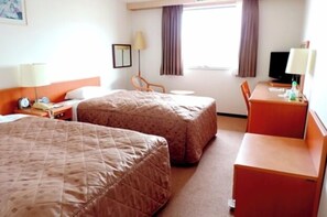 A hotel room with two beds, a desk, a chair, a television, and a window with curtains. - Fuji View Hotel Shin-Yokohama (Yokohama)