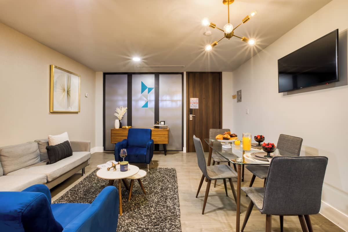 Stylish Apartment | Living area | 43-inch TV with digital channels, streaming services