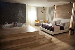 Luxury Suite, Pool View | Minibar, in-room safe, desk, laptop workspace