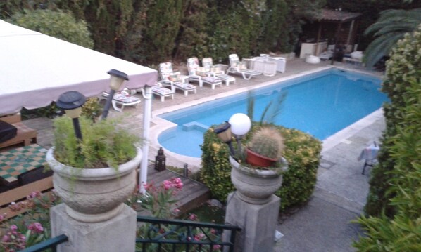 A pool area with lounge chairs and a covered seating area. - small paradise, pool villa, 400M Nice beach, the countryside in the city center. (Nice)