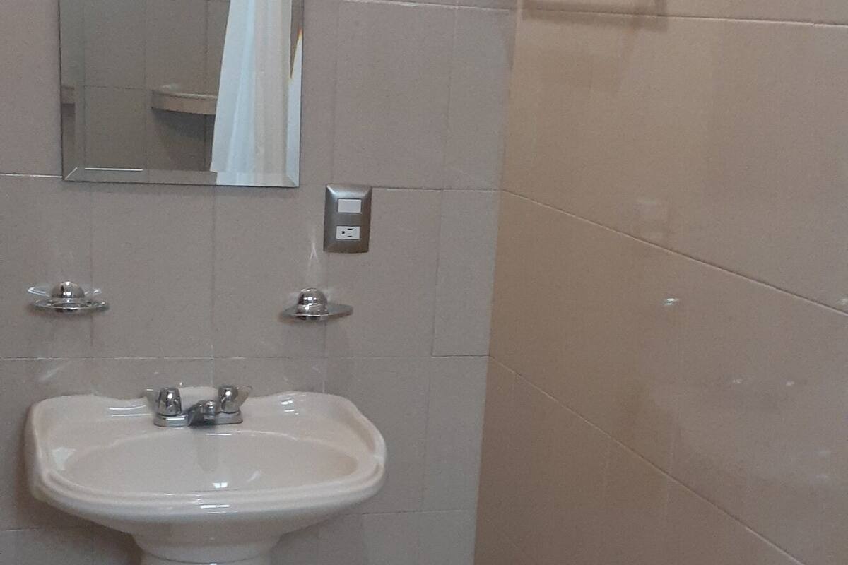 standard room, multiple beds | bathroom | shower, rainfall showerhead, towels, soap