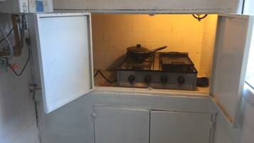 Family Duplex, Multiple Beds | Private kitchen | Fridge, microwave, stovetop, cookware/dishes/utensils