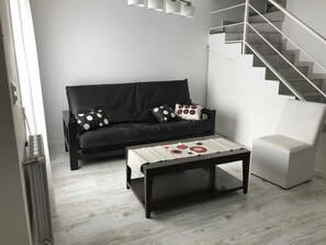 Dúplex familiar, varias camas | Área de sala de estar