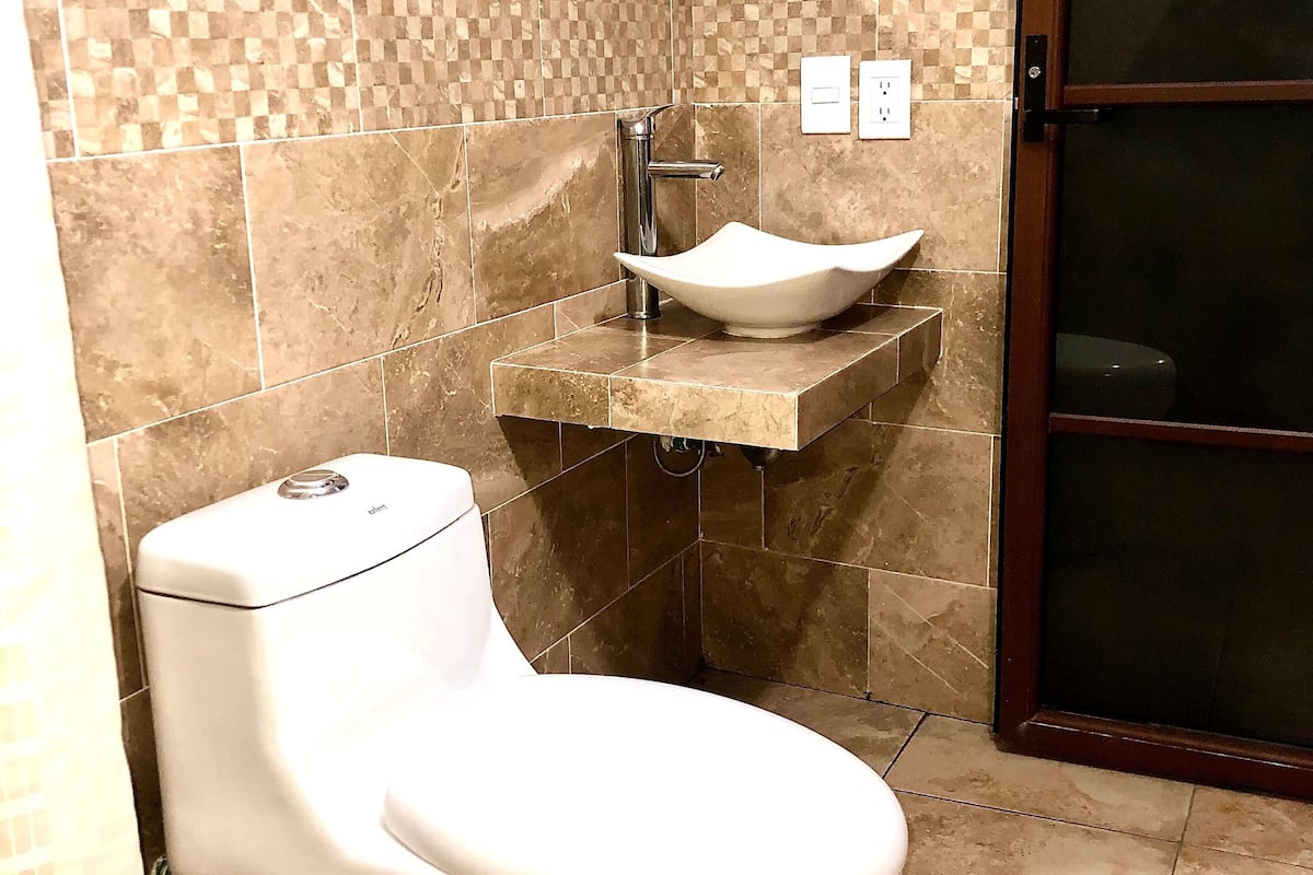 classic double room | bathroom | shower, towels, soap, shampoo