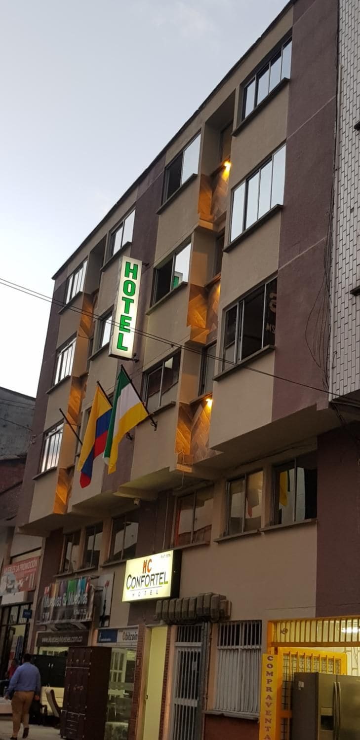 A multi-story hotel building with a prominent "HOTEL" sign.