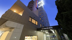 A modern hotel building with a prominent sign for KUII DA-LICHI HOTEL. - Kuji Daiichi Hotel (Kuji)