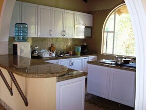 Private kitchen - Beautiful house immersed in nature (Tibacuy)