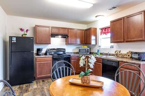 Fully-Equipped Kitchen with Table and Chairs