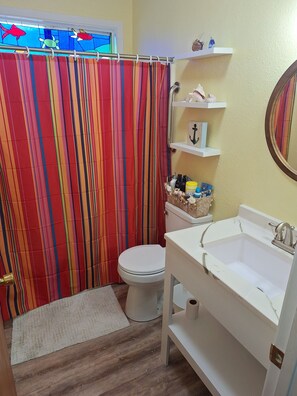 Combined shower/tub, hair dryer, towels, soap