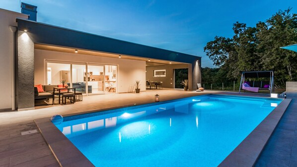 Outdoor pool, a heated pool, pool loungers